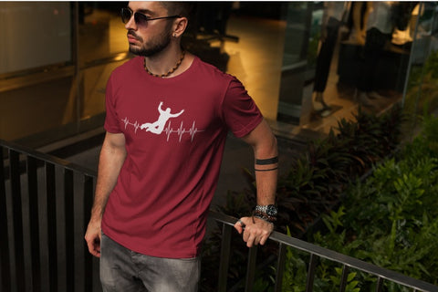This red unisex t-shirt with white print is everything you have dreamed of and more. It feels soft and lightweight with the right amount of stretch. It is comfortable and flattering for both men and women and with heartbeat with a basejumper print on the front. Available in several colours.