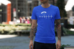 This blue unisex t-shirt with white print is everything you have dreamed of and more. It feels soft and lightweight with the right amount of stretch. It is comfortable and flattering for both men and women and with heartbeat with a skydiver print on the front. Available in several colours.